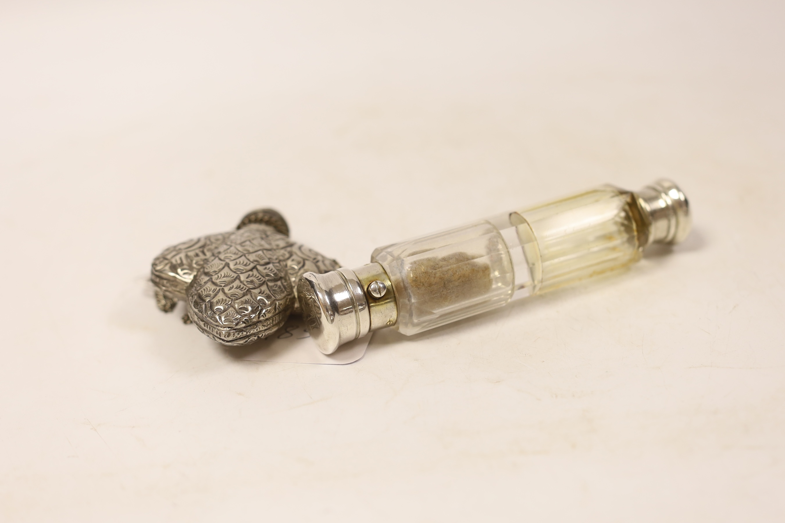 A white metal mounted double ended scent bottle, 14.5cm and one other white metal scent flask.